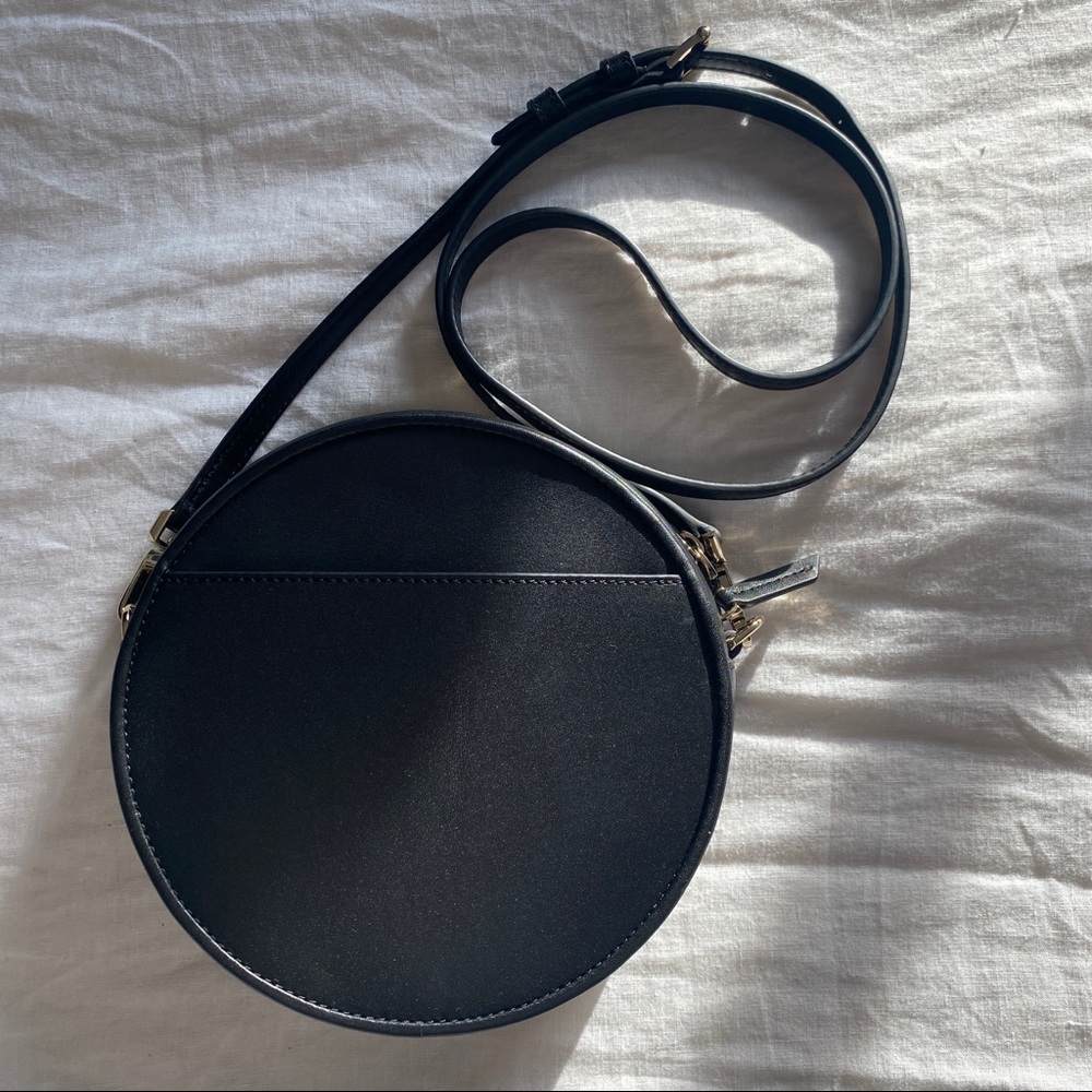 NWT still in package! Italic black leather round crossbody bag!